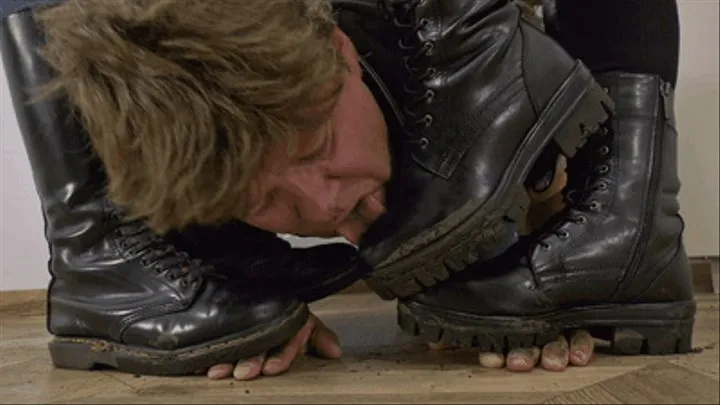 Muddy boot licking during hand trampling