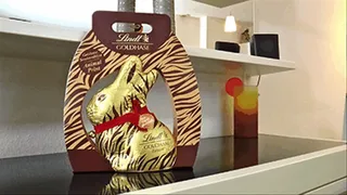 Crushing a big chocolate rabbit into pieces