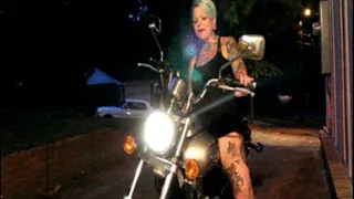 Sweet Cheeks Revving a Motorcycle While Smoking
