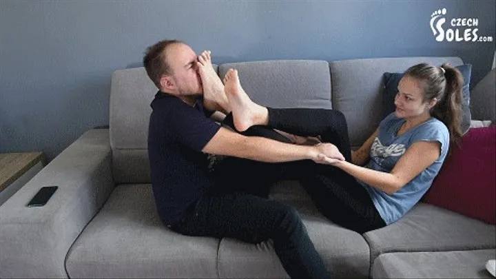 Pushing her sweaty feet and socks on his face for sniffing