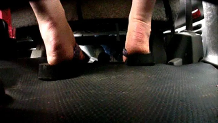 Feet in truck toes in flip flops
