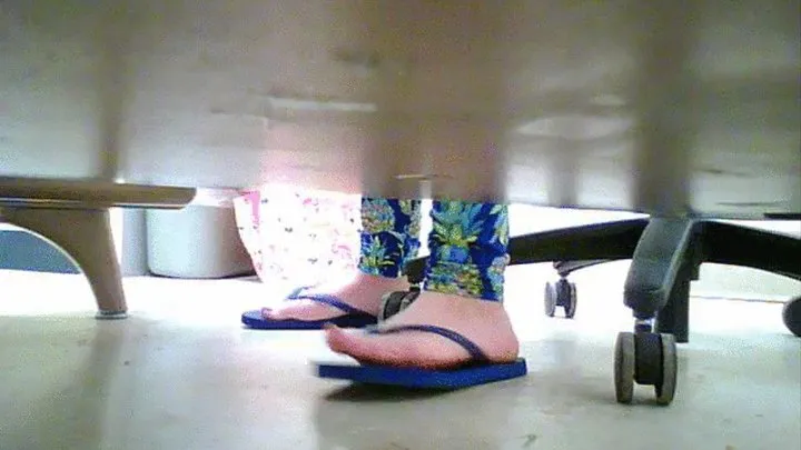 bule Flip flops under teachers desk