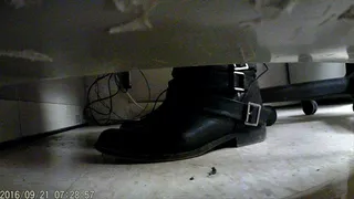teachers boots under desk pumping her heel