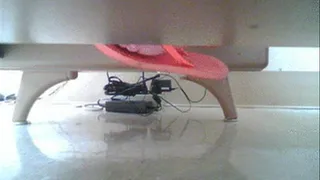 Flip flops under teachers desk