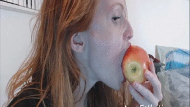 Biting an apple and moaning with juicy red lips!