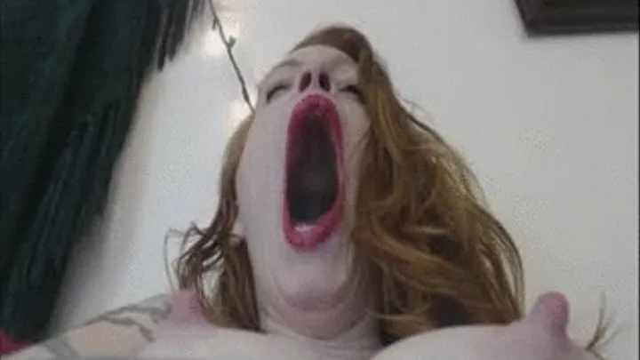 Topless redhead yawns in your face