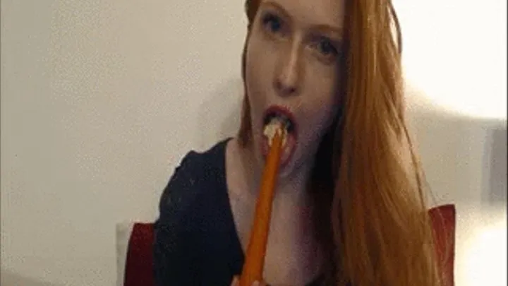 Yummy redhead eats a snack