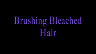 Mistress Isadora brushing her Bleach Blonde Hair
