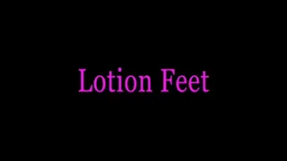 Mistress Isadora rubs lotion on her feet