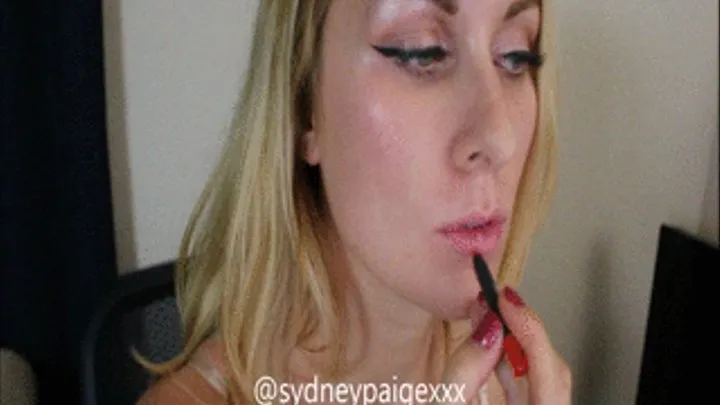 Watch Sydney Paige apply bright red lipstick!
