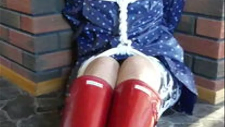 JEAN BALLGAGGED IN RUBBERBOOTS.