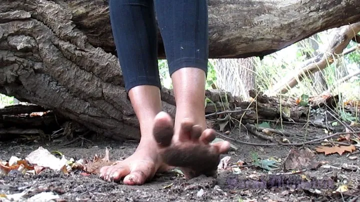 Walking on the Earth barefoot soiled feet