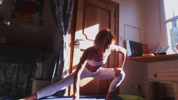 Stretching in white leggings