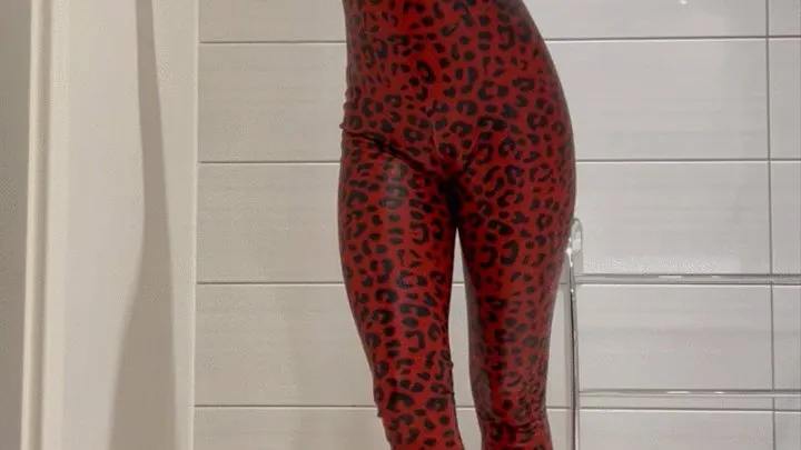 red leopard skin latex catsuit tease in bathroom