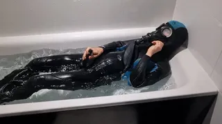 gasmask and wetsuit in bathtub cum