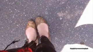 Cindy shows her ballerinas on the dashboard while driving