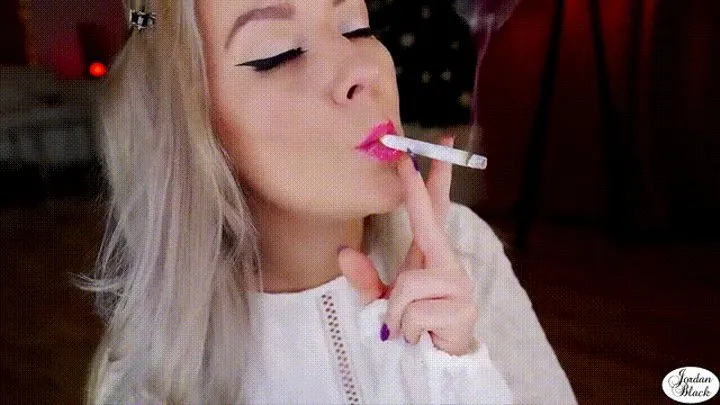 Glossy pink lips on a cork cigarette