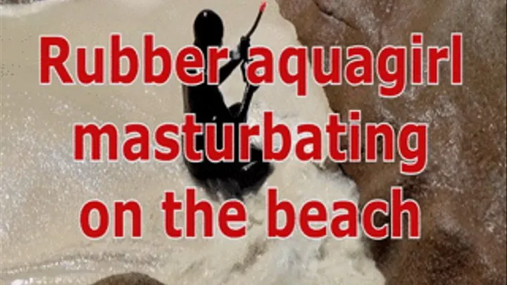 Rubber aquagirl masturbating on the beach