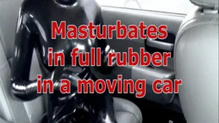 Masturbates in full rubber in a moving car