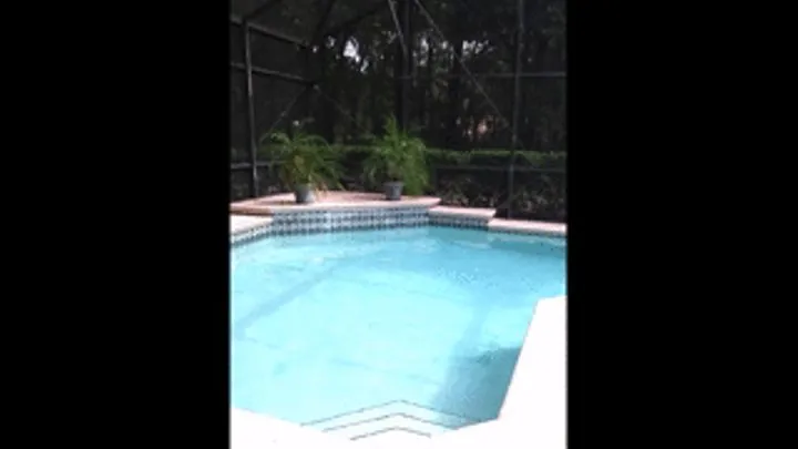 Missy wearing tight denim jeans and boots getting wet in pool