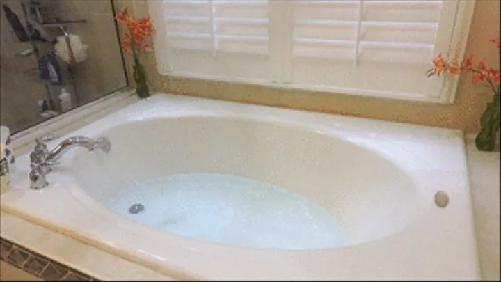 Bathtub in very tight white T-Shirt and Levis jeans