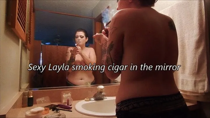 Sexy Layla smoking cigar topless in the mirror