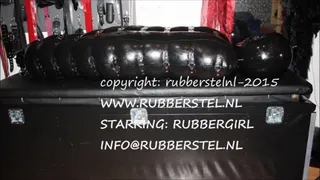 rubbergirl hanging in heavy rubber bondage