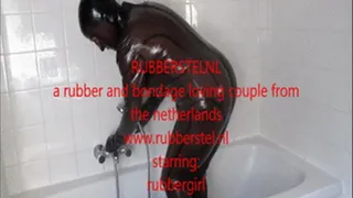 Rubbergirl Masturbating in the Bathroom