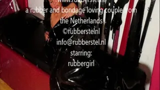 rubbergirl on e-stim in rubber bag