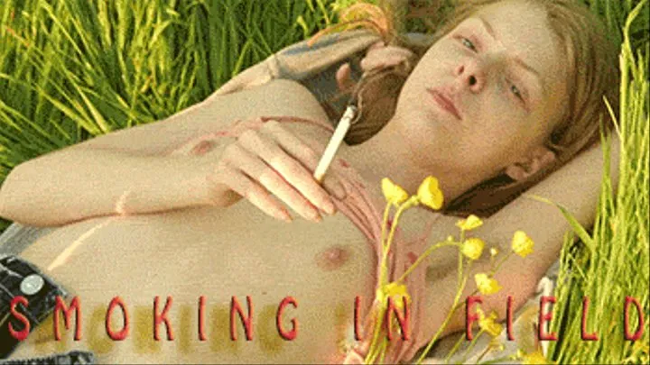 Smoking Red Head Outdoors in a Field