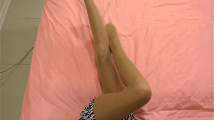 Sheer pantyhose with spandex on the bed.