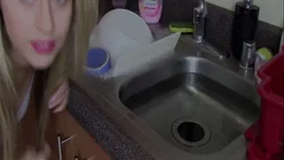 Washing Dishes With Purple Gloves