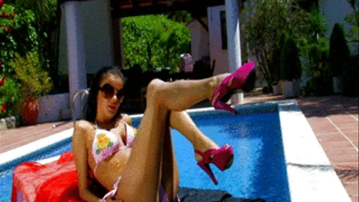 Busty young babe in bikini stripping and dancing at the pool