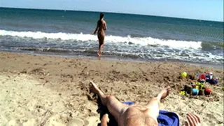 Chubby young latina girl playing naked on the beach and peeing on an old guy