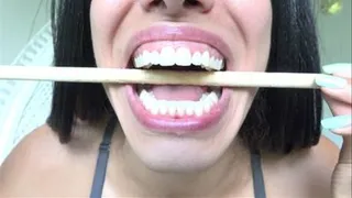 Alena Chews A Dowel