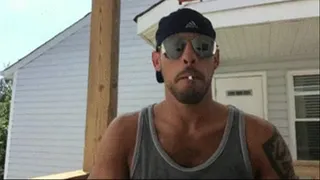 Stud pounds a marlboro on his porch