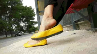 Waiting in yellow ballet flats