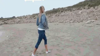 Walking on the sea in new adidas sneakers and pink socks