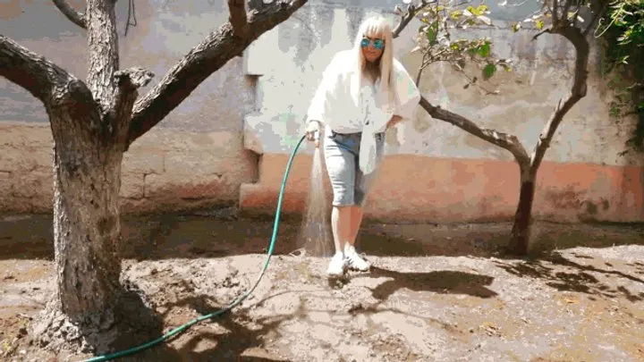 Elizabeth watering the garden