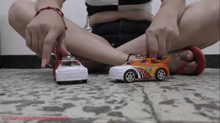 Lorena vs 2 toy cars