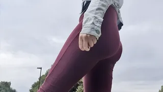 Red leggings in the park peeing