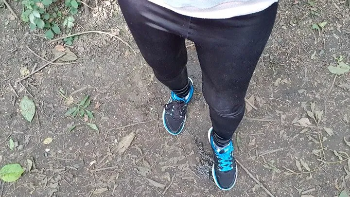 Black leggings peeing in the woods