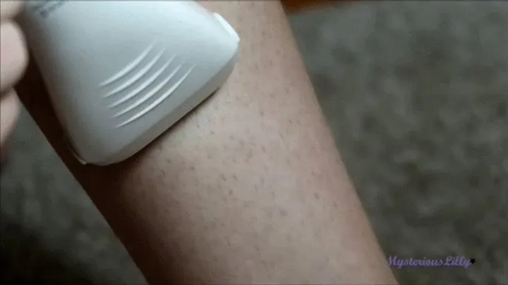 Electric razor, leg shaving, big close up