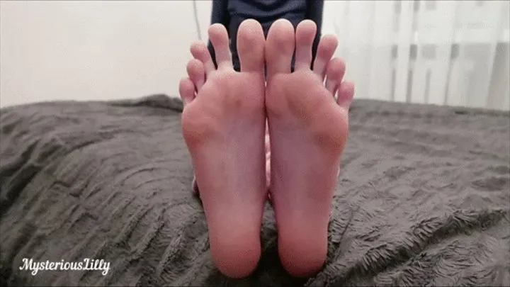 Lilly's slender soles and long toes