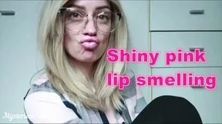 Shiny pink lip smelling