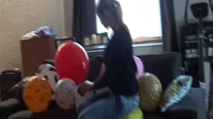 Sophie sit and squeeze balloons