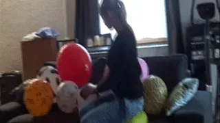 Sophie sit and squeeze balloons