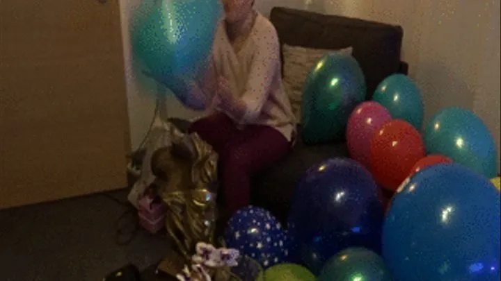 Caroline popping balloons