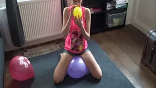 Sophie sit and pop balloons