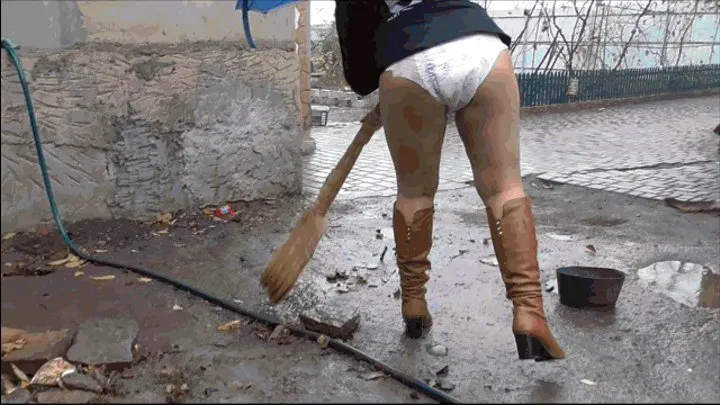 Cleaning in a diaper on the street.